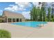 Community pool with an adjacent clubhouse and ample deck space, providing a perfect spot for leisure and socializing at 66 Cottontail Ln, Loganville, GA 30052