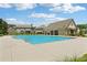 Large community pool with a surrounding deck, with clubhouse close by, enhancing the neighborhood's recreational appeal at 66 Cottontail Ln, Loganville, GA 30052