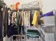 Walk-in closet with hanging racks and storage shelves at 66 Cottontail Ln, Loganville, GA 30052