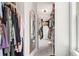 Well-organized walk-in closet featuring ample hanging space and built-in storage drawers at 66 Cottontail Ln, Loganville, GA 30052