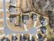 Aerial view of a neighborhood showcasing the home's location on a cul-de-sac at 7995 Brewton Creek Dr, Cumming, GA 30028
