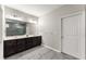 Elegant bathroom featuring double sinks and a glass-enclosed shower at 7995 Brewton Creek Dr, Cumming, GA 30028