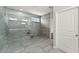 The bathroom offers a spacious glass shower and modern finishes at 7995 Brewton Creek Dr, Cumming, GA 30028