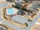 Aerial view of community pool with playground and parking area at 7995 Brewton Creek Dr, Cumming, GA 30028