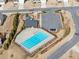 Aerial view of the community pool with playground, parking, and landscaping at 7995 Brewton Creek Dr, Cumming, GA 30028