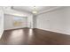 Spacious living room with lots of natural light, trey ceiling, and hardwood floors at 7995 Brewton Creek Dr, Cumming, GA 30028