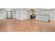 Open-concept basement showcasing the kitchen, open floorplan, and wood-look floors at 1131 Mayfield Dr, Decatur, GA 30033