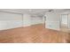 Spacious finished basement featuring wood-look floors, recessed lights, and wainscotting at 1131 Mayfield Dr, Decatur, GA 30033