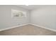 Bedroom features carpet flooring and a window, offering a bright and airy feel at 1131 Mayfield Dr, Decatur, GA 30033