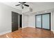 Spacious bedroom features wood-look floors, ceiling fan, and large closet space at 1131 Mayfield Dr, Decatur, GA 30033