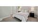 Bedroom features a tufted headboard, neutral color scheme, and carpeted floors at 1131 Mayfield Dr, Decatur, GA 30033