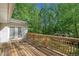 A spacious deck overlooking a lush, wooded backyard offering privacy and relaxation at 1131 Mayfield Dr, Decatur, GA 30033