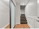 Hallway featuring stairs, closet with sliding door, and hard wood floors at 1131 Mayfield Dr, Decatur, GA 30033