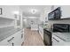 The kitchen boasts white cabinetry, granite countertops, and stainless steel appliances at 1131 Mayfield Dr, Decatur, GA 30033