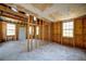 Unfinished room featuring bare studs, windows and door; ready for customization at 1131 Mayfield Dr, Decatur, GA 30033