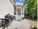 Outdoor living space featuring a grill, patio, and easy access to the backyard at 1963 Skybrooke Ln, Hoschton, GA 30548