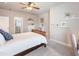 Bedroom with an ensuite bathroom, queen bed, and decor at 1963 Skybrooke Ln, Hoschton, GA 30548
