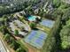 Aerial view of community amenities including tennis courts, pool, and clubhouse at 1963 Skybrooke Ln, Hoschton, GA 30548