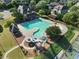 Aerial view of the pool and play area, featuring a large pool and fun winding slides at 1963 Skybrooke Ln, Hoschton, GA 30548