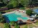 Aerial view of the neighborhood pool featuring winding slides and a splash pad at 1963 Skybrooke Ln, Hoschton, GA 30548