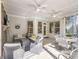 Inviting covered porch with ceiling fans and stylish, comfortable seating area perfect for entertaining at 1963 Skybrooke Ln, Hoschton, GA 30548