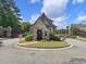 The neighborhood features a grand stone entry, a gated entrance, and manicured landscaping at 1963 Skybrooke Ln, Hoschton, GA 30548