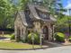 Attractive stone community entrance with mature landscaping and a welcoming ambiance at 1963 Skybrooke Ln, Hoschton, GA 30548