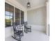 Charming front porch with rocking chairs, perfect for relaxing at 1963 Skybrooke Ln, Hoschton, GA 30548