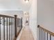 An upstairs hallway features neutral-toned walls, plush carpeting, and elegant trim work at 1963 Skybrooke Ln, Hoschton, GA 30548