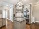 Well-equipped kitchen with hardwood floors, granite countertops, stainless steel appliances, and a stylish island at 1963 Skybrooke Ln, Hoschton, GA 30548