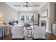 Inviting living room with coffered ceiling, fireplace, and large windows offering plenty of natural light at 1963 Skybrooke Ln, Hoschton, GA 30548