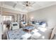 Comfortable living room with hardwood floors, coffered ceilings, and a cozy fireplace at 1963 Skybrooke Ln, Hoschton, GA 30548