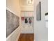 Hallway mudroom features built-in lockers, drawers, and hardwood floors at 1963 Skybrooke Ln, Hoschton, GA 30548