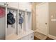 Well-organized mudroom features custom built-ins with hooks and storage cabinets near the entrance for convenience at 1963 Skybrooke Ln, Hoschton, GA 30548