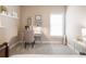 Cozy office space with natural light, a desk, chair, and decor at 1963 Skybrooke Ln, Hoschton, GA 30548