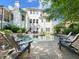 Spacious backyard with a sparkling pool, stone patio, and seating area for enjoying the outdoors at 1963 Skybrooke Ln, Hoschton, GA 30548
