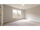 Bedroom features a window and carpeted floor at 4822 Floydwood Ln, Mableton, GA 30126