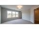 Inviting bedroom with a large window, neutral carpet, and ample space for relaxation and comfort at 4822 Floydwood Ln, Mableton, GA 30126