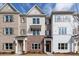 Charming townhomes featuring a mix of brick and siding, complemented by well-manicured landscaping at 4822 Floydwood Ln, Mableton, GA 30126