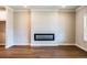 Modern living room with a sleek fireplace, hardwood floors, and ample natural light at 4822 Floydwood Ln, Mableton, GA 30126