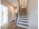 Elegant staircase with wood treads and modern railings, adding a touch of sophistication at 4822 Floydwood Ln, Mableton, GA 30126