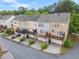 Aerial view of townhomes showcasing decks, manicured landscaping, and a peaceful neighborhood at 4879 Seldon Se Way, Smyrna, GA 30080