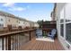 Back deck with railing and view of adjacent townhomes at 4879 Seldon Se Way, Smyrna, GA 30080