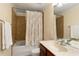 Full bathroom featuring shower over tub with tile surround and vanity with sink at 4879 Seldon Se Way, Smyrna, GA 30080
