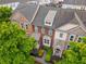 Well-maintained brick townhome with a landscaped walkway and lush greenery at 4879 Seldon Se Way, Smyrna, GA 30080