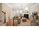 A living room featuring a fireplace, hardwood floors, and a staircase with iron railings at 4879 Seldon Se Way, Smyrna, GA 30080