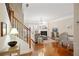 A living room featuring a fireplace, hardwood floors, and a staircase with iron railings at 4879 Seldon Se Way, Smyrna, GA 30080
