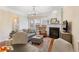 A living room featuring a fireplace, hardwood floors, and furniture, with view to an outdoor deck at 4879 Seldon Se Way, Smyrna, GA 30080