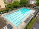 Community pool with lounge chairs, seating, and trees at 4879 Seldon Se Way, Smyrna, GA 30080