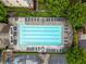 Aerial shot of a community pool surrounded by seating, landscaping, and parking at 4879 Seldon Se Way, Smyrna, GA 30080